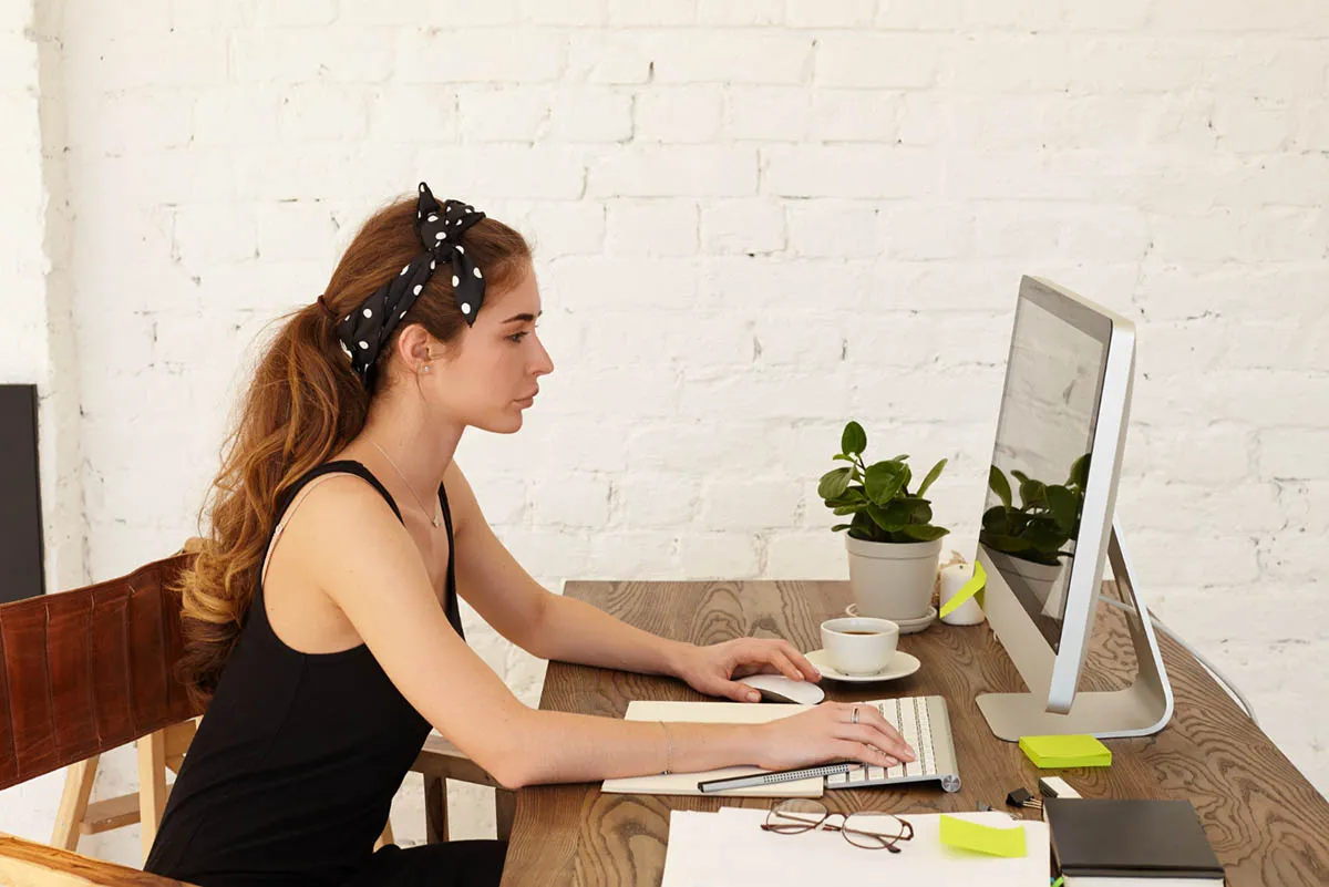 Standing desk silhouette near window
